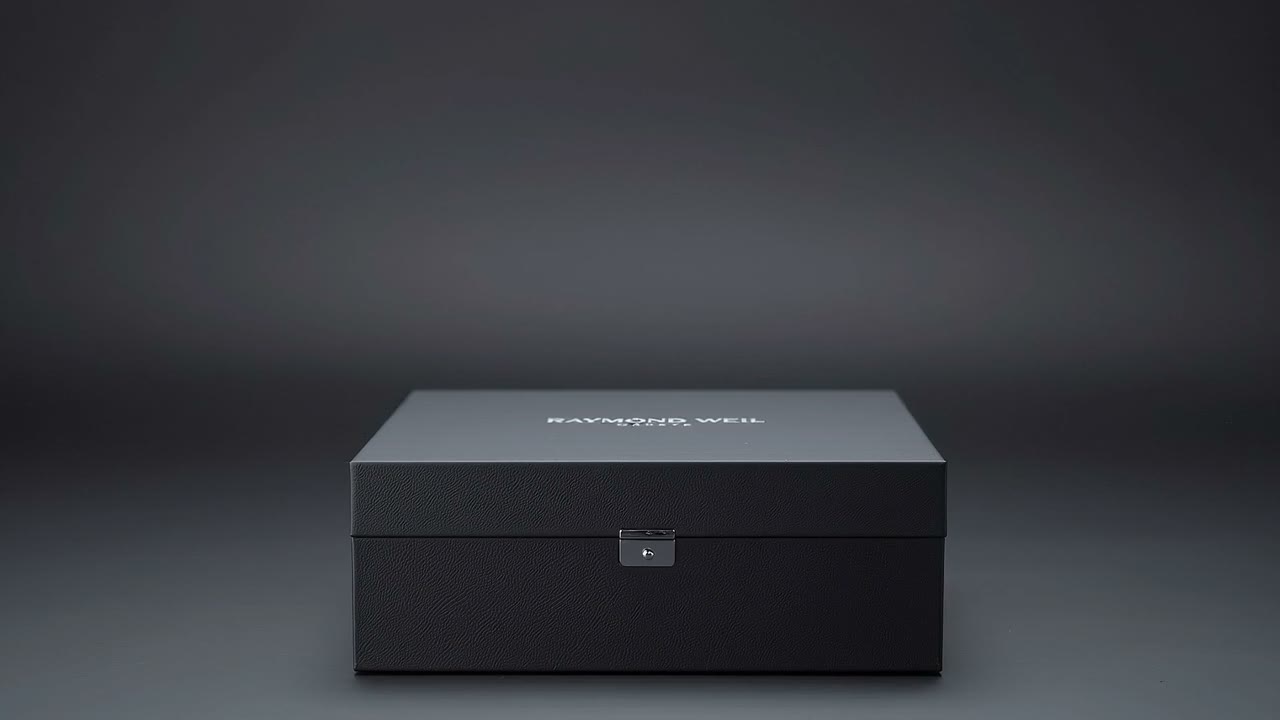 A watch presented in an opening display box